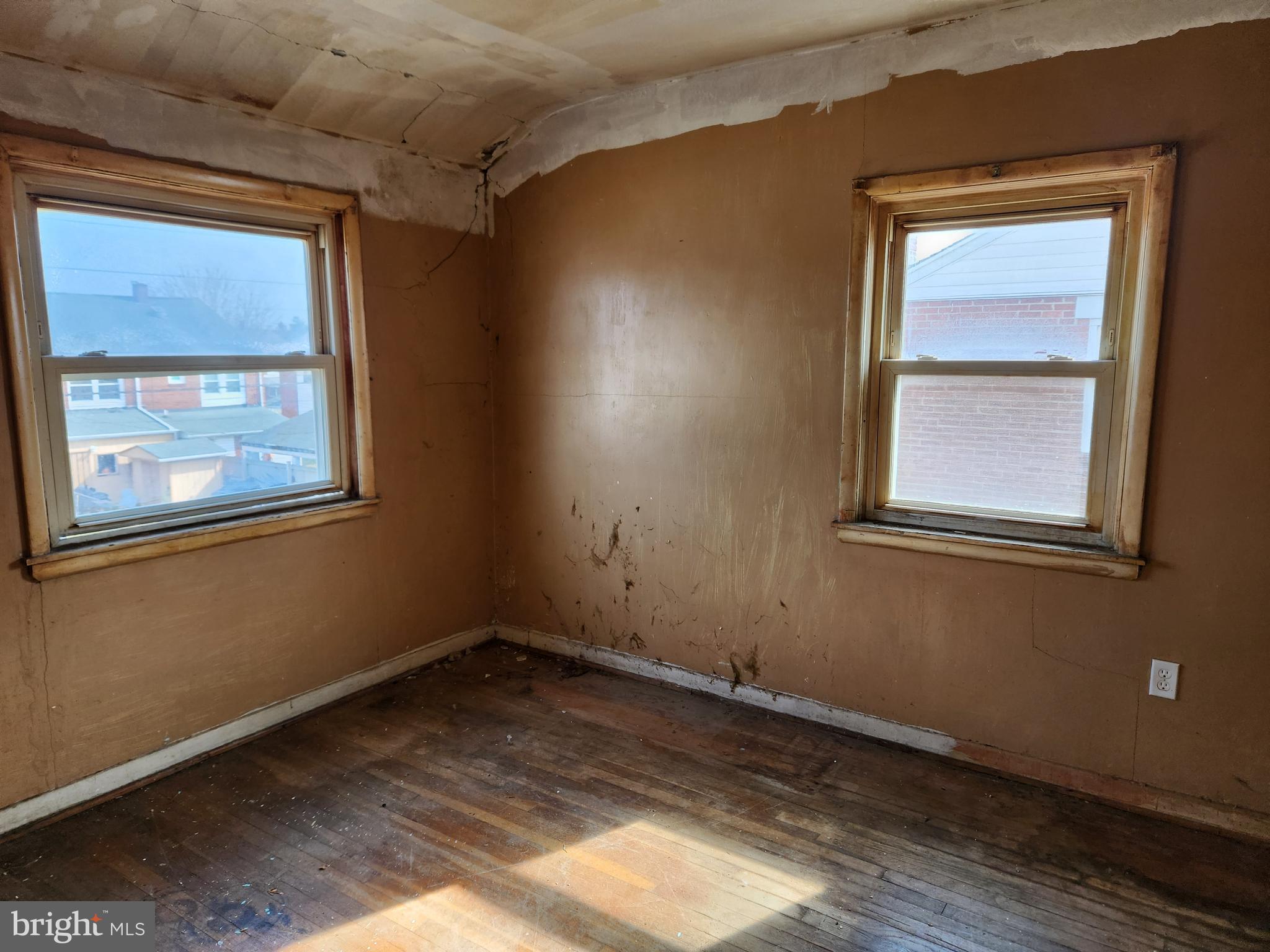 2041 Jasmine Road Baltimore, MD 21222 - Photo 10 of 21 a view of empty room with windows