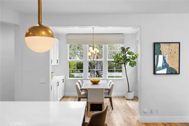 a kitchen with sink refrigerator and window