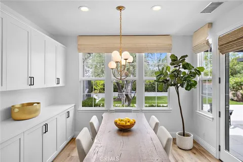 a bathroom with a sink mirror and a toilet