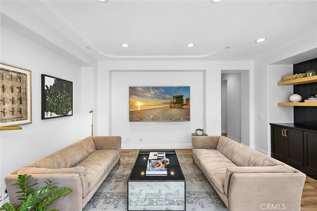 a spacious bedroom with a bed and a large window