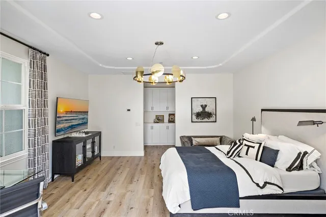 a bathroom with a granite countertop sink and a window