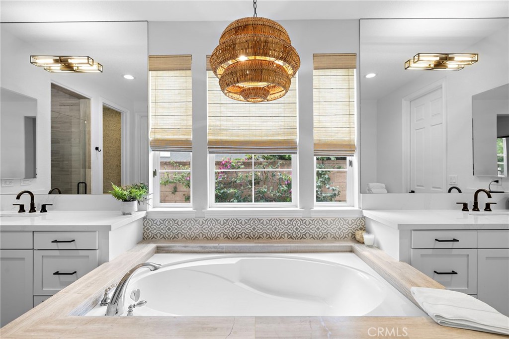 1 Drackert Lane Ladera Ranch, CA 92694 - Photo 29 of 57 a bathroom with a tub a sink and a window