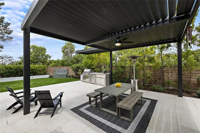 a white bench sitting in middle of the forest