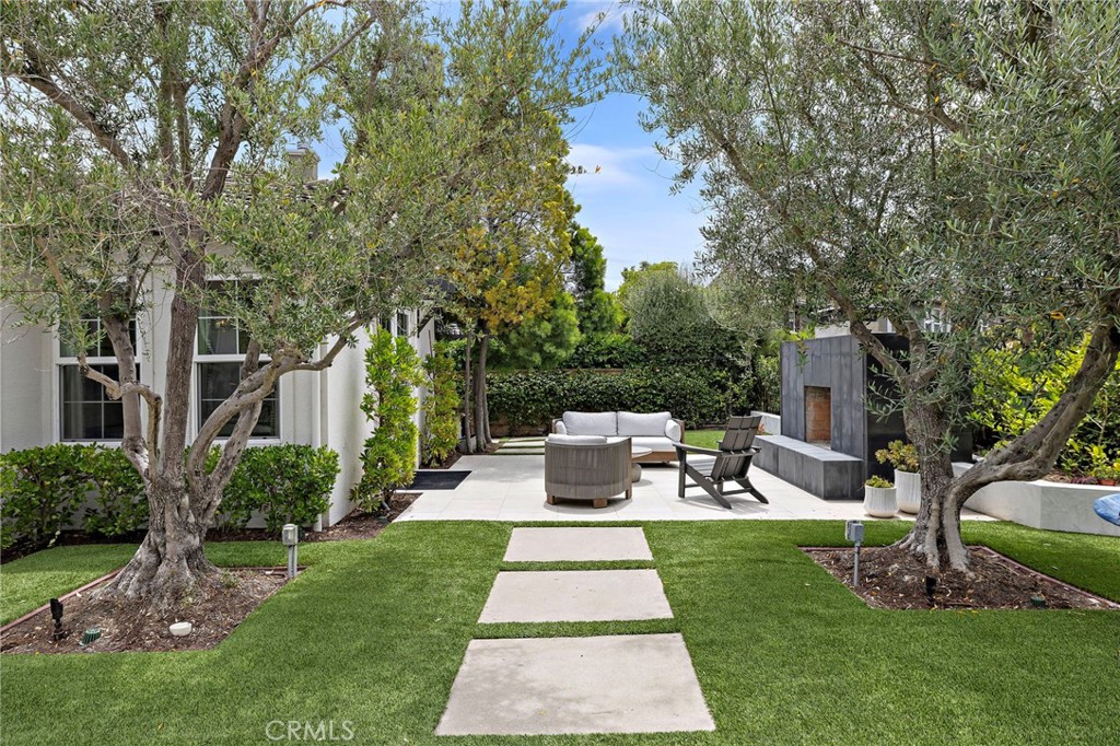 1 Drackert Lane Ladera Ranch, CA 92694 - Photo 47 of 57 a view of a patio with couches table and chairs with plants and trees