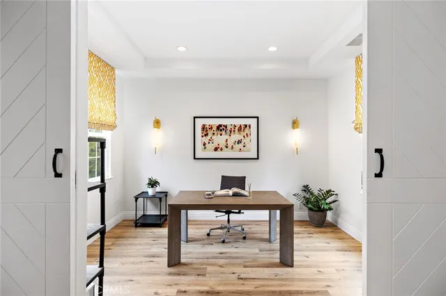 a kitchen with a table chairs sink and cabinets