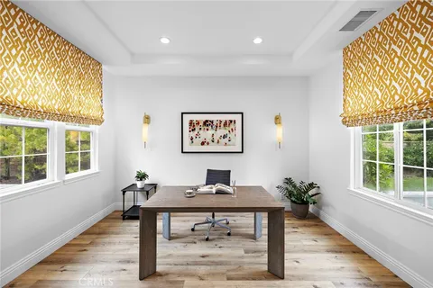 a large kitchen with a table and chairs