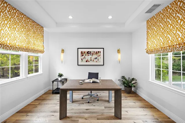 a large kitchen with a table and chairs