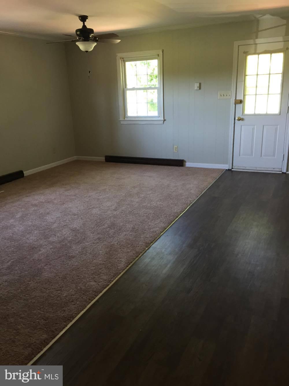 9671 Clarkes Road Bealeton, VA 22712 - Photo 5 of 12 an empty room with a empty space and windows