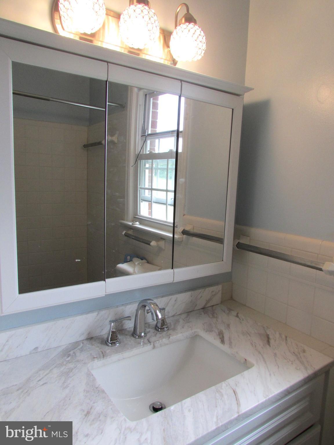 9671 Clarkes Road Bealeton, VA 22712 - Photo 6 of 12 a bathroom with a sink and a mirror