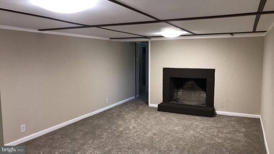 9671 Clarkes Road Bealeton, VA 22712 - Photo 8 of 12 a room with a fireplace and a ceiling fan