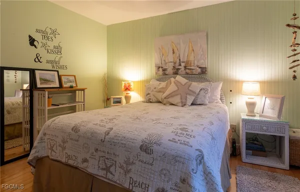 a bedroom with a bed and a fireplace