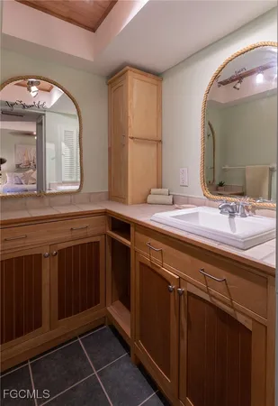 a bathroom with a double vanity sink and a mirror