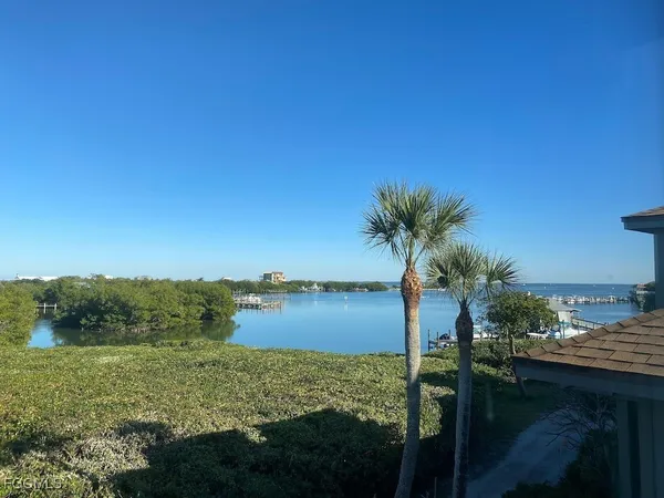 a view of a lake with a yard