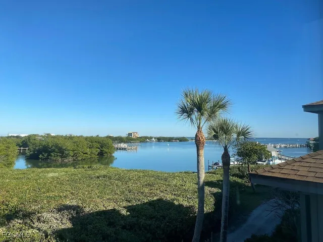 a view of a lake with a yard