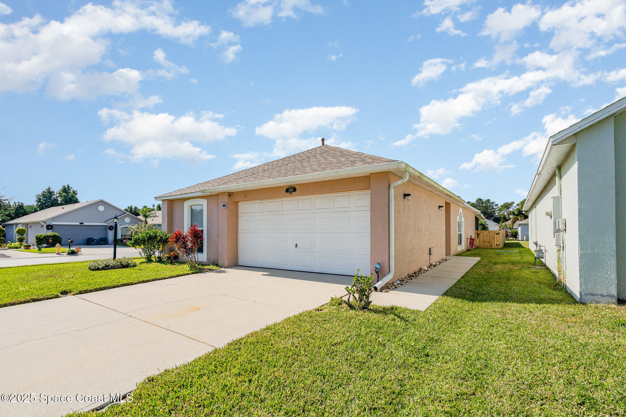 2188 Redwood Circle Palm Bay, FL 32905 - Photo 3 of 24 front & side