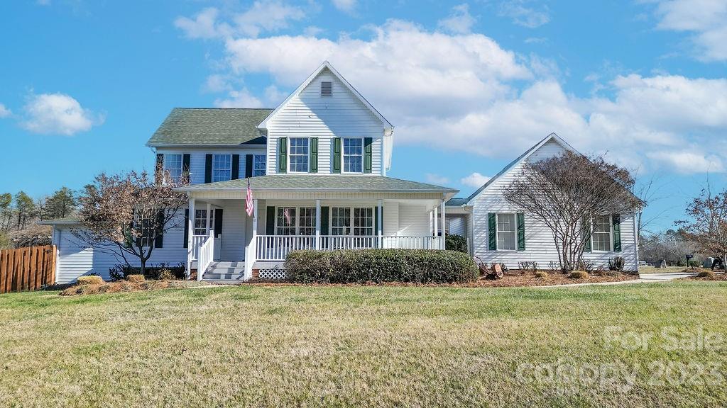 6715 Faith Road Salisbury, NC 28146 - Photo 1 of 48 a front view of a house with garden