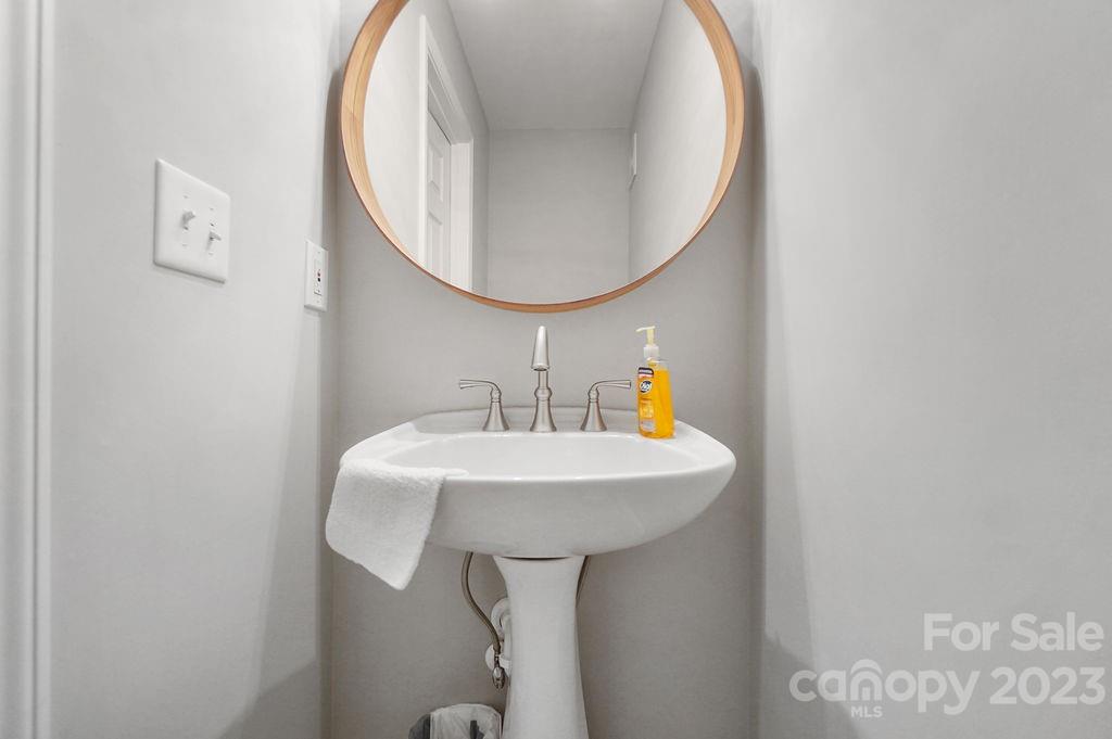 6715 Faith Road Salisbury, NC 28146 - Photo 30 of 48 a bathroom with a sink and a mirror