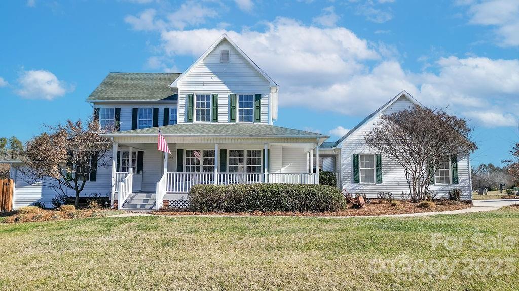6715 Faith Road Salisbury, NC 28146 - Photo 3 of 48 a front view of a house with a yard