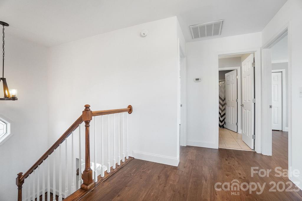 6715 Faith Road Salisbury, NC 28146 - Photo 33 of 48 a view of a hallway view with wooden floor and staircase