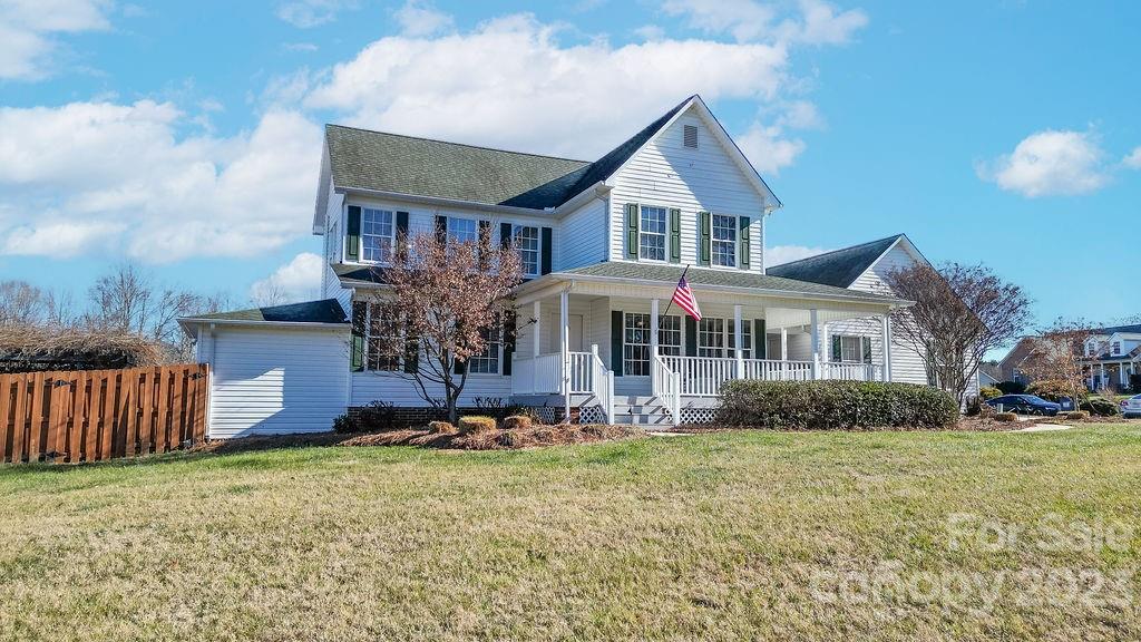6715 Faith Road Salisbury, NC 28146 - Photo 5 of 48 a front view of a house with garden