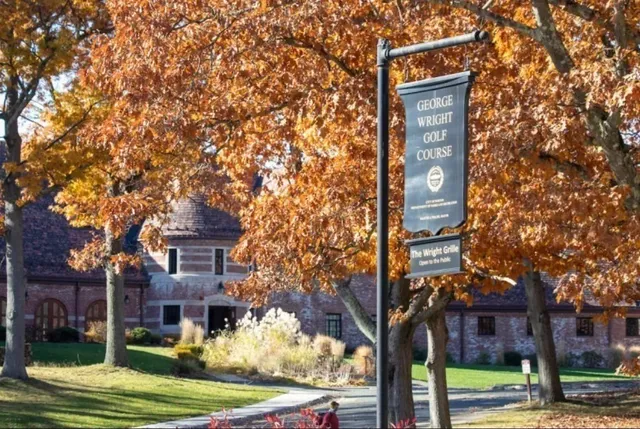 a view of a building with car parked