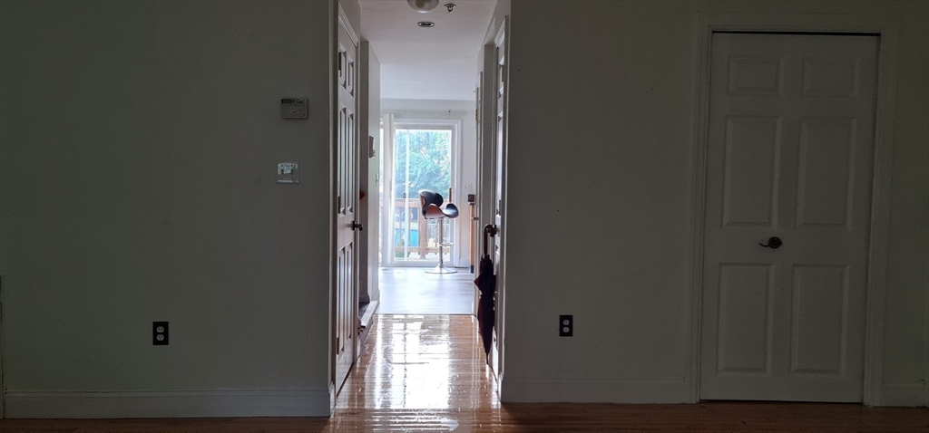 41 West Street, Unit 3 Boston, MA 02136 - Photo 5 of 23 a view of an entryway with wooden floor