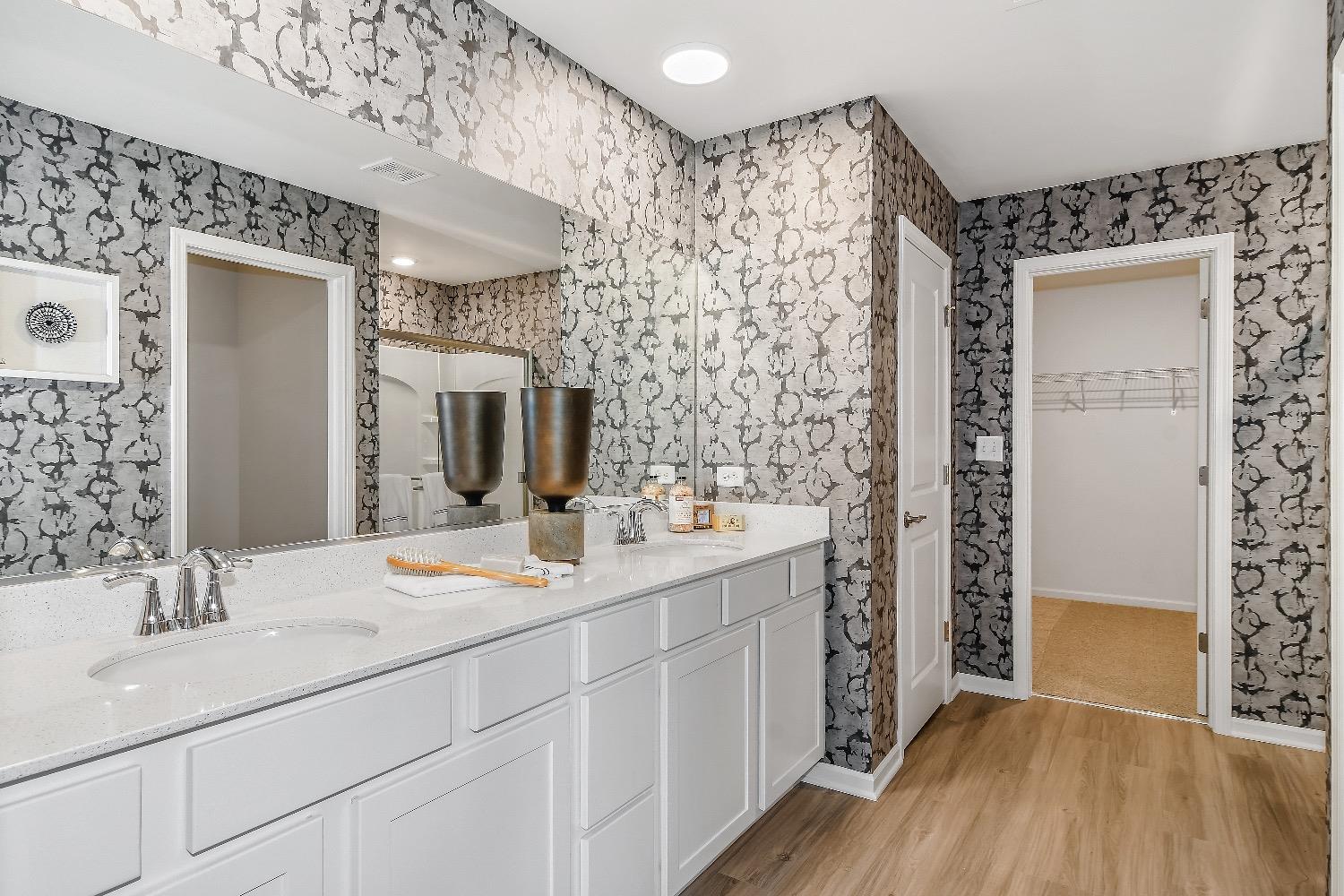 11566 Clyde Crown Point Merrillville, IN 46410 - Photo 14 of 27 a bathroom with a double vanity sink mirror and shower
