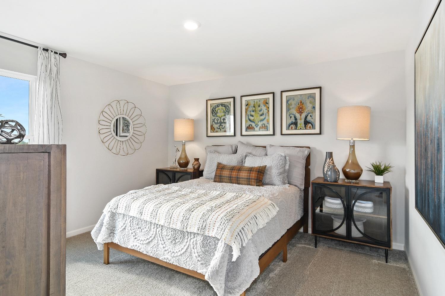 11566 Clyde Crown Point Merrillville, IN 46410 - Photo 17 of 27 a bedroom with a bed lamp and a window