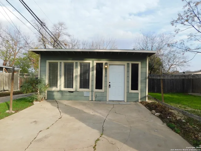 a house with yard in front of it