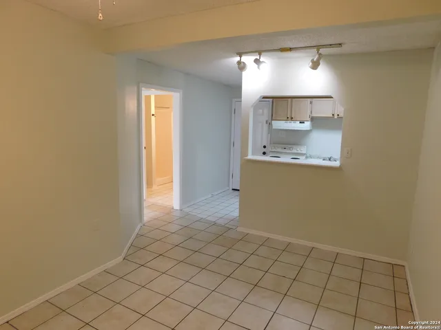 a view of a kitchen with wooden floor