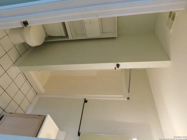 a view of an empty room and window