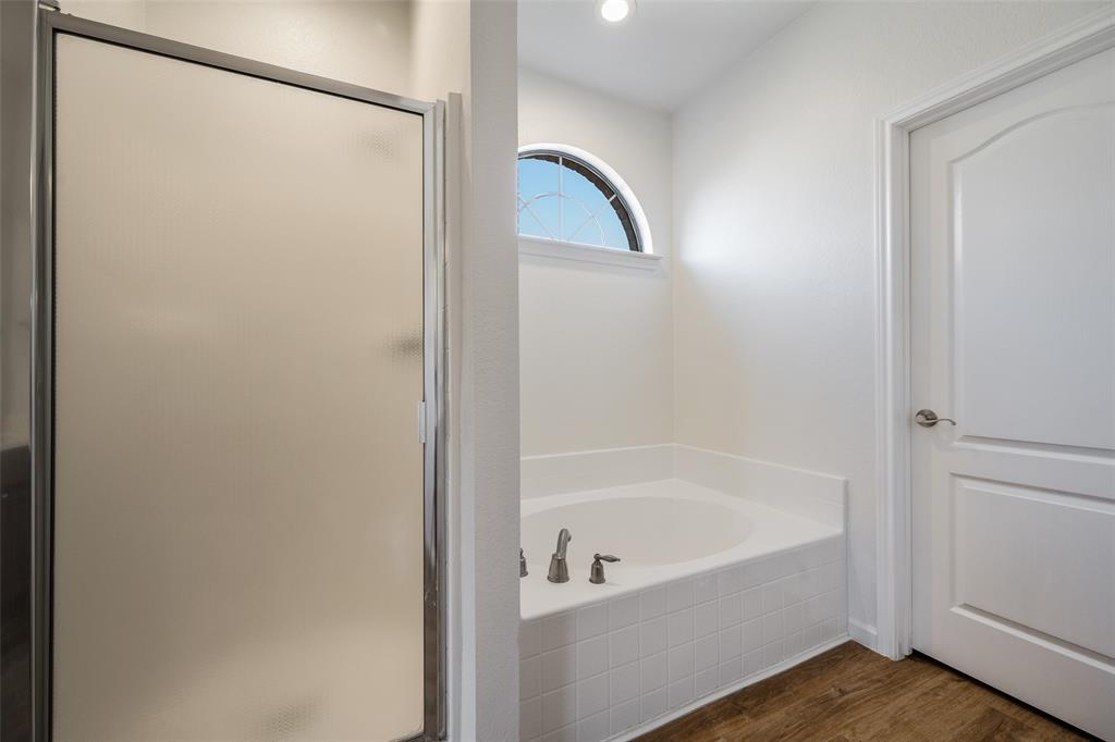 826 Hazel's Way Anna, TX 75409 - Photo 15 of 25 a bathroom with a bathtub and shower