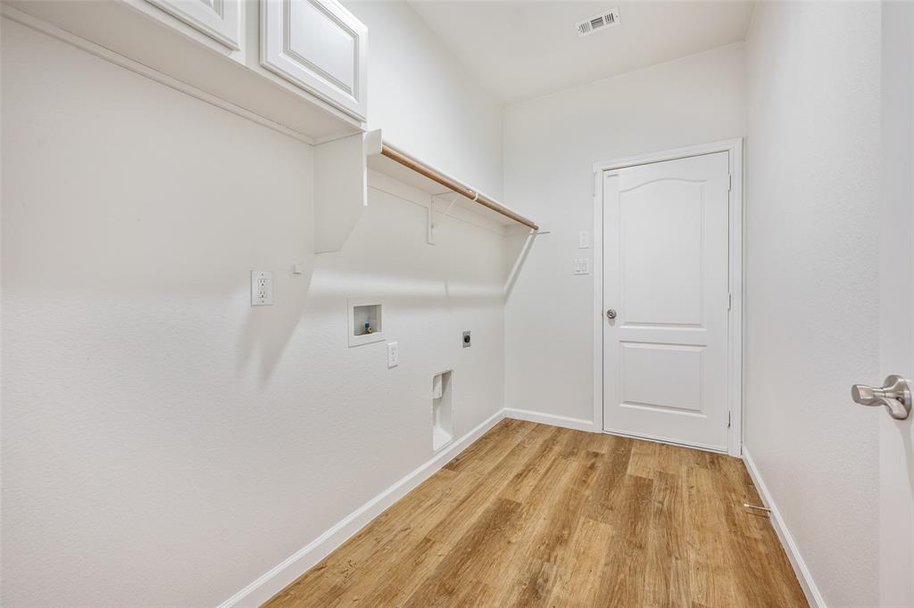 826 Hazel's Way Anna, TX 75409 - Photo 16 of 25 a view of a room with wooden floor