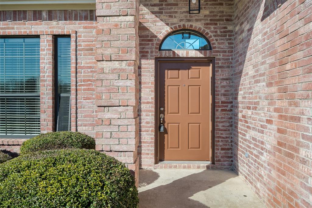 826 Hazel's Way Anna, TX 75409 - Photo 2 of 25 a couple of potted plants in front of door