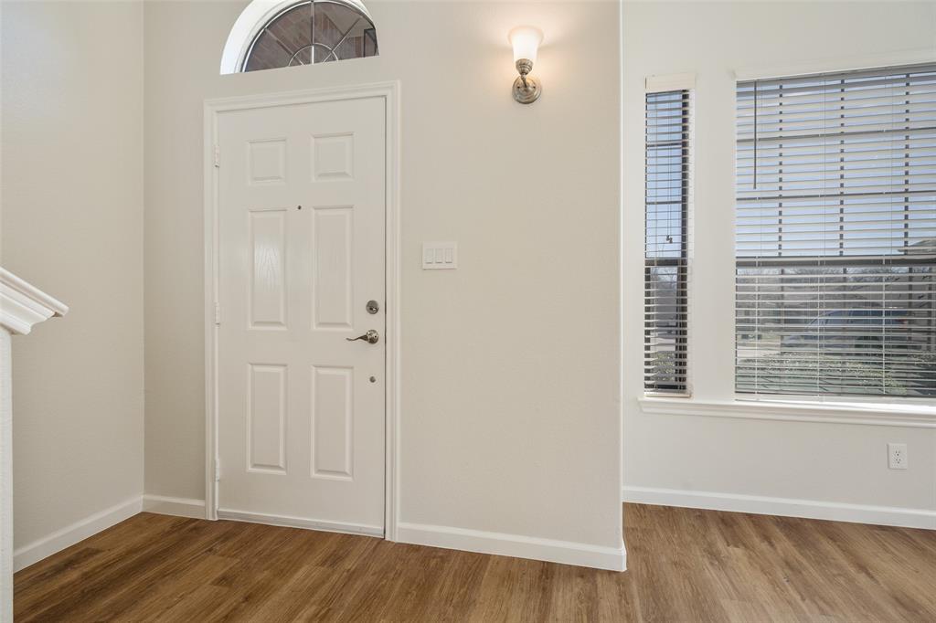 826 Hazel's Way Anna, TX 75409 - Photo 3 of 25 a view of front door with wooden floor