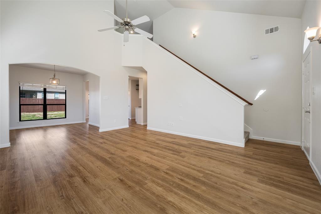 826 Hazel's Way Anna, TX 75409 - Photo 5 of 25 a view of an empty room with window and wooden floor