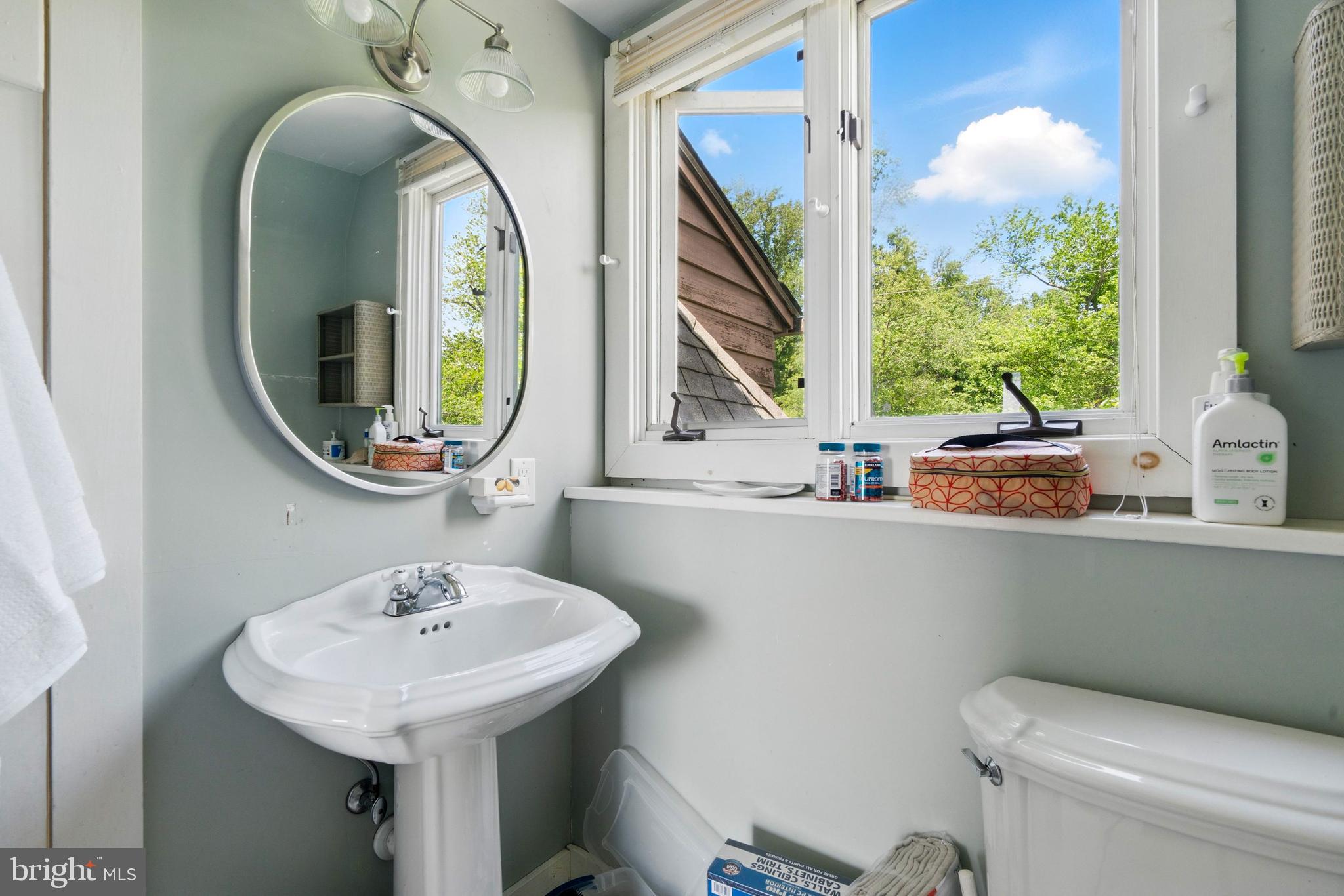 215 Dove Lane Elkton, MD 21921 - Photo 26 of 46 a bathroom with a toilet sink and mirror