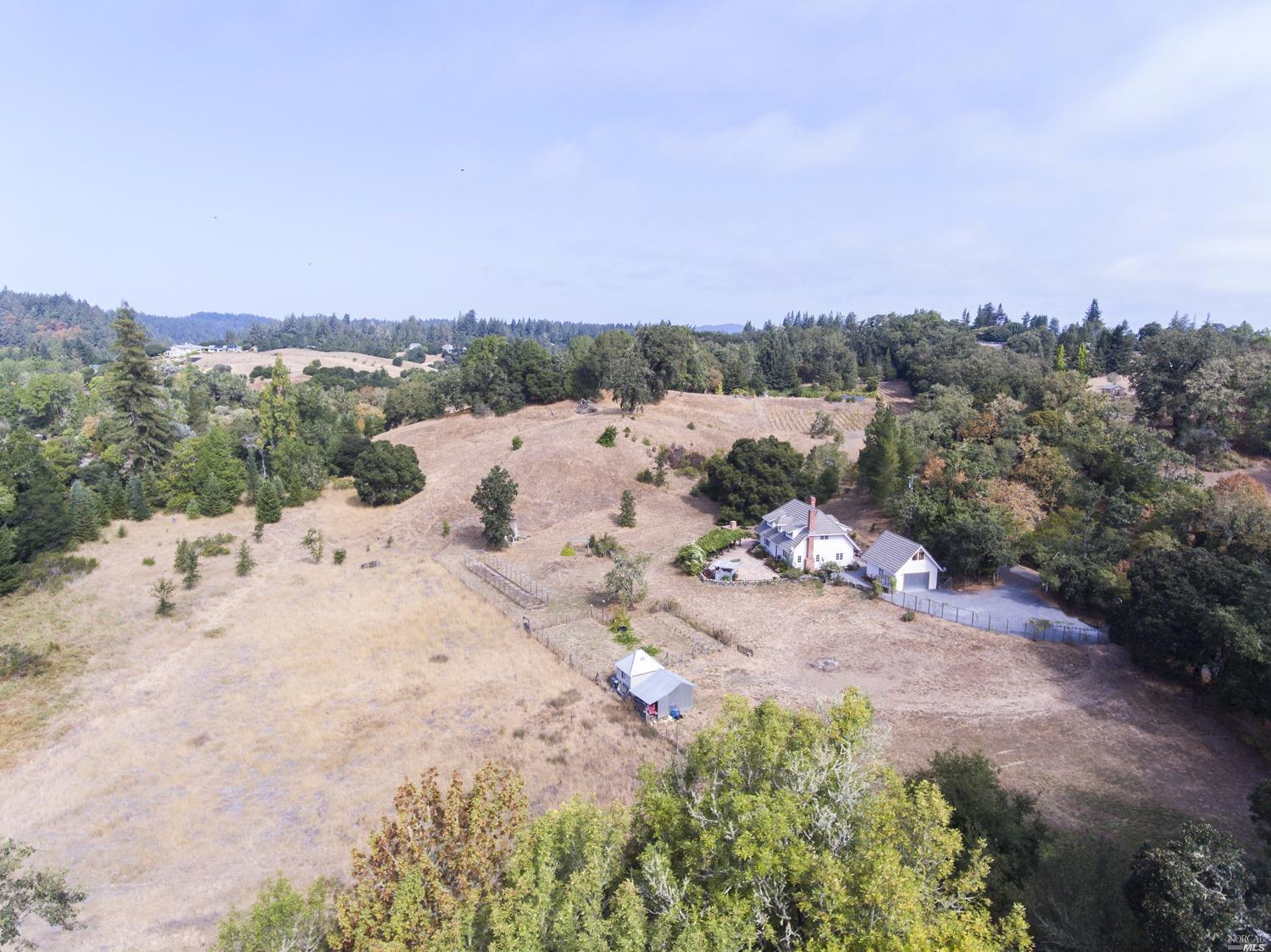 3902 Bones Road Sebastopol, CA 95472 - Photo 1 of 1 a view of a dry yard with mountains in the background