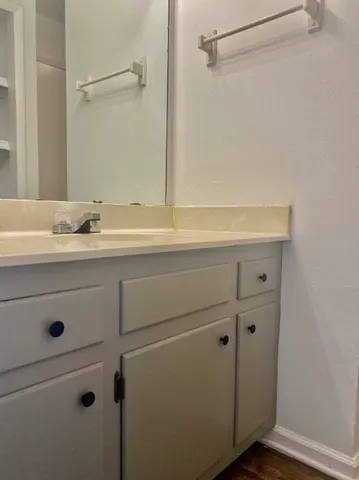a bathroom with a sink and mirror