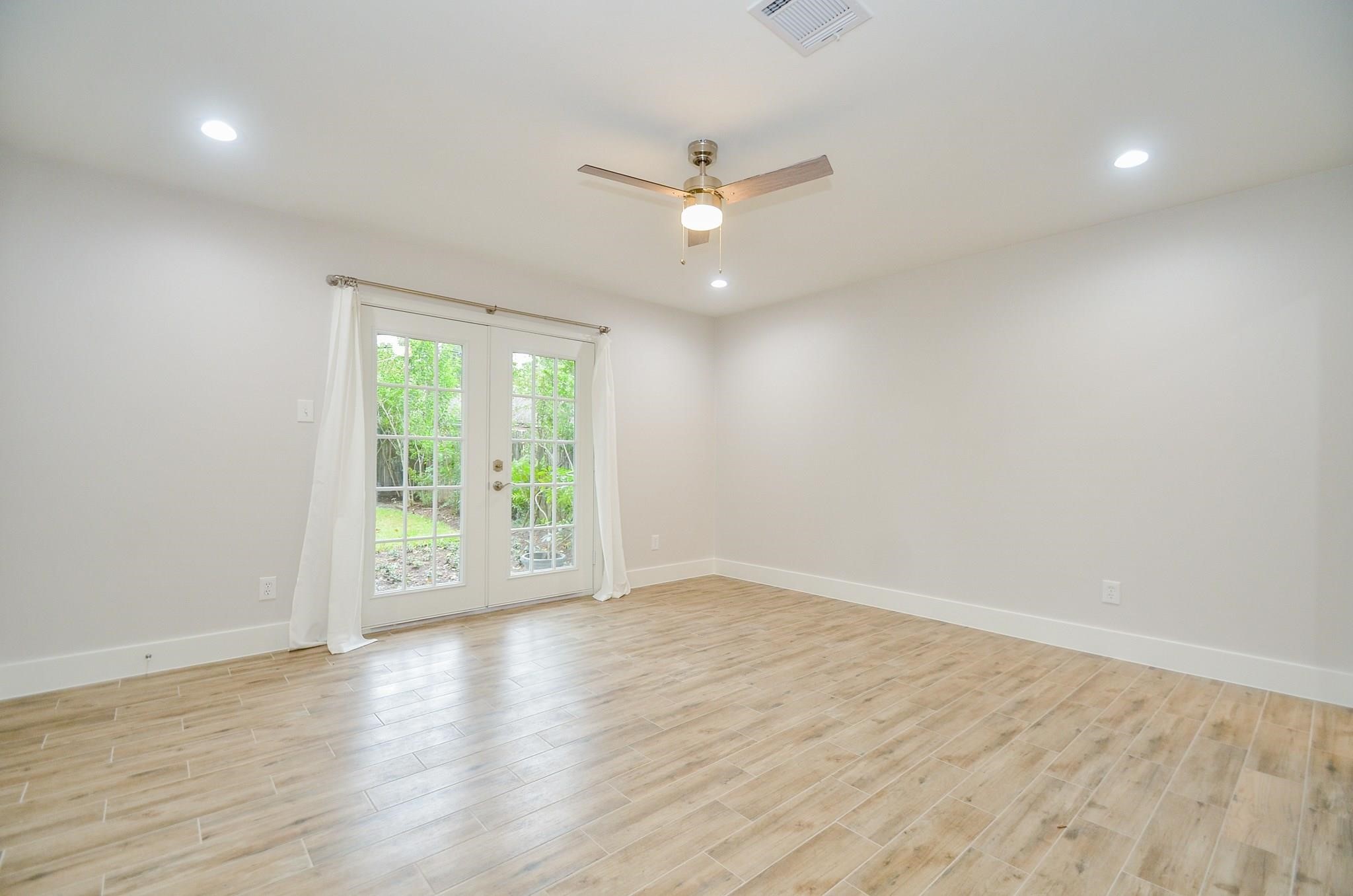 7414 Grape Street Houston, TX 77074 - Photo 13 of 27 Primary bedroom with French doors