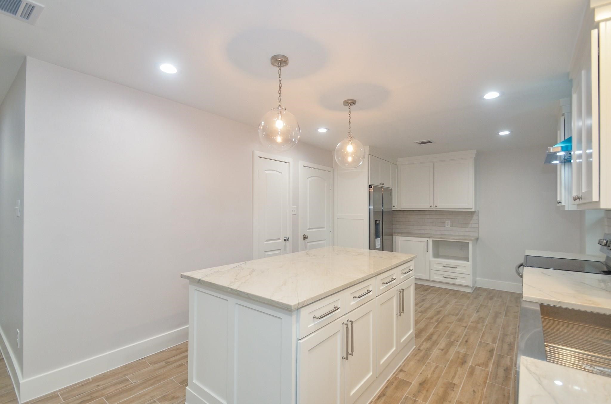 7414 Grape Street Houston, TX 77074 - Photo 4 of 27 Large Island Counter. Chef's dream kitchen with all the space.