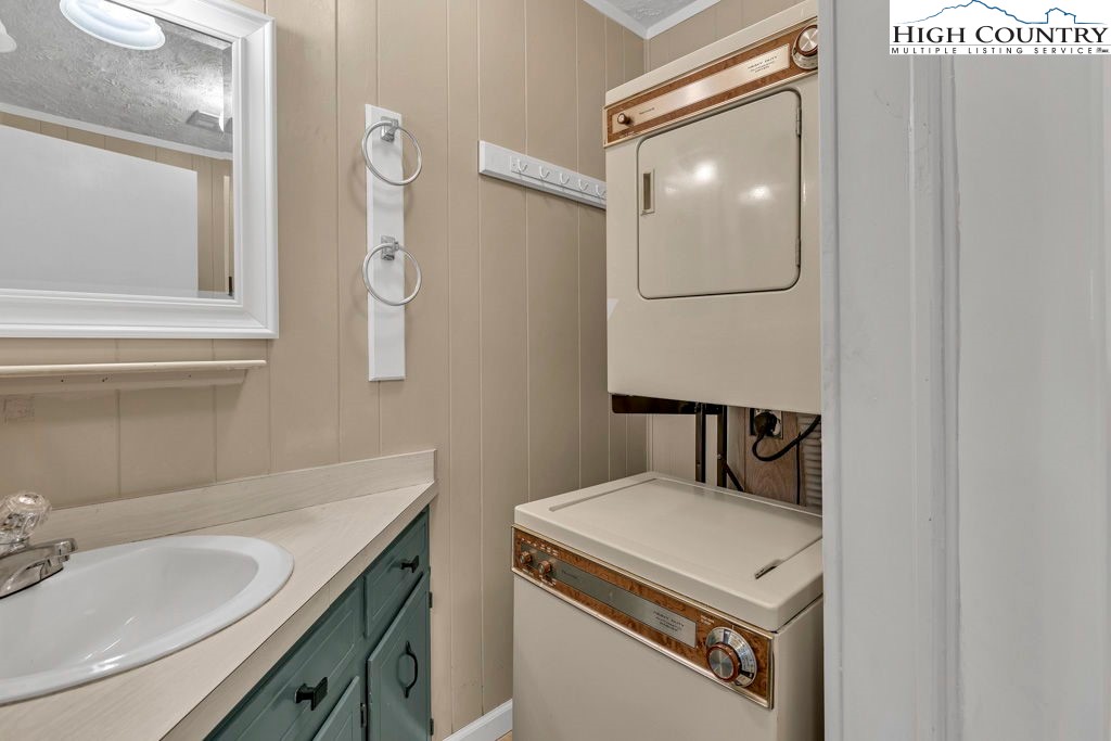 101 Hornbeam Road, Unit 2B Beech Mountain, NC 28604 - Photo 15 of 35 a bathroom with a sink and a mirror