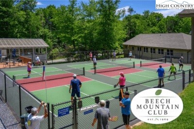 101 Hornbeam Road, Unit 2B Beech Mountain, NC 28604 - Photo 32 of 35 an outdoor space with furniture and umbrella
