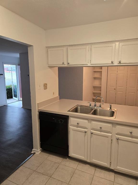 1111 Bert Drive, Unit C Arlington, TX 76012 - Photo 11 of 11 a kitchen with a sink and cabinets