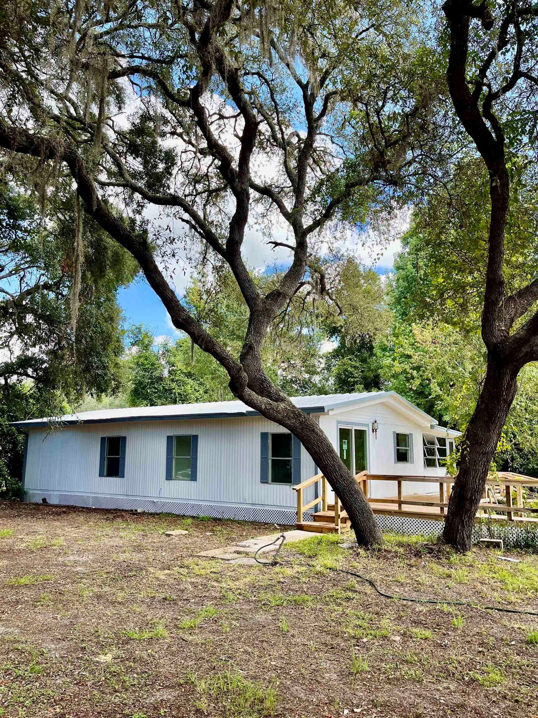a house view with a backyard space