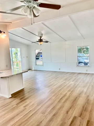 a view of kitchen with wooden floor and window