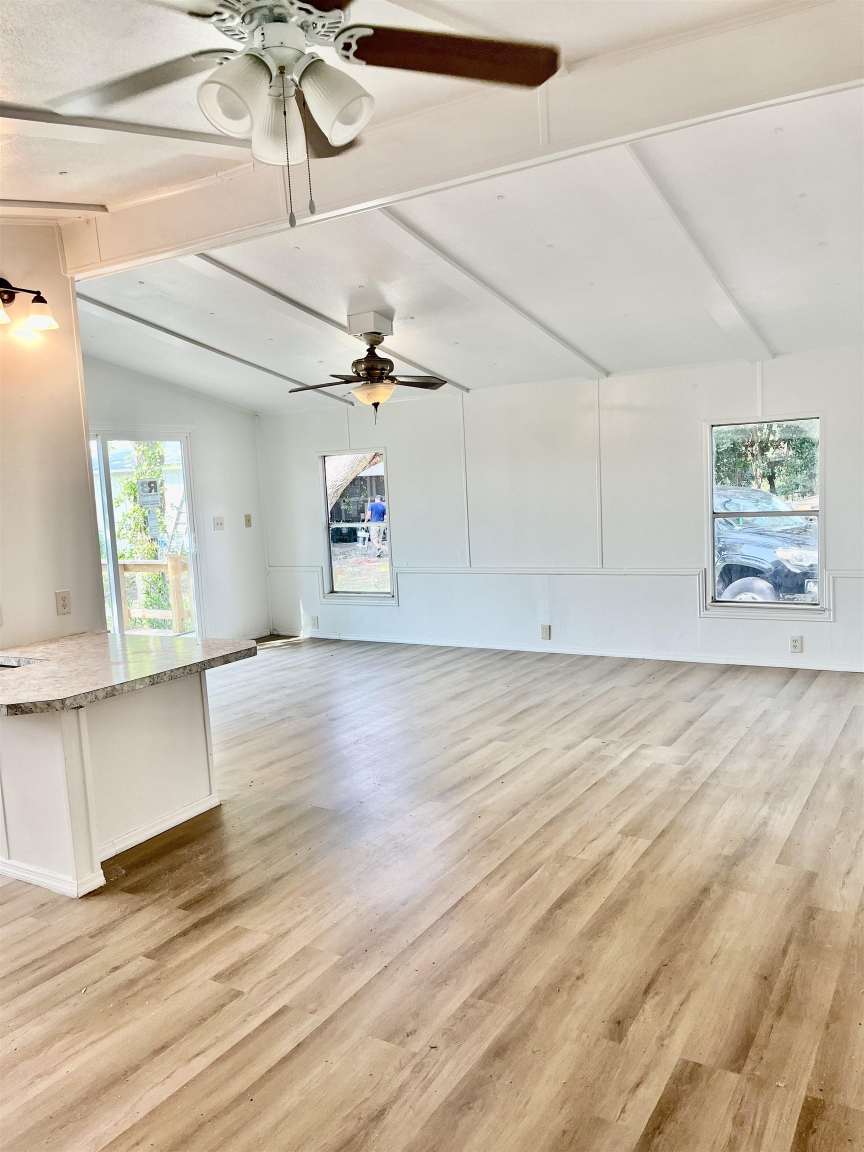 23670 Northeast 154th Place Road Salt Springs, FL 32134 - Photo 13 of 65 a view of an empty room with a window and wooden floor