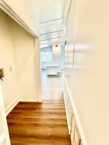a bathroom with a sink mirror vanity and toilet