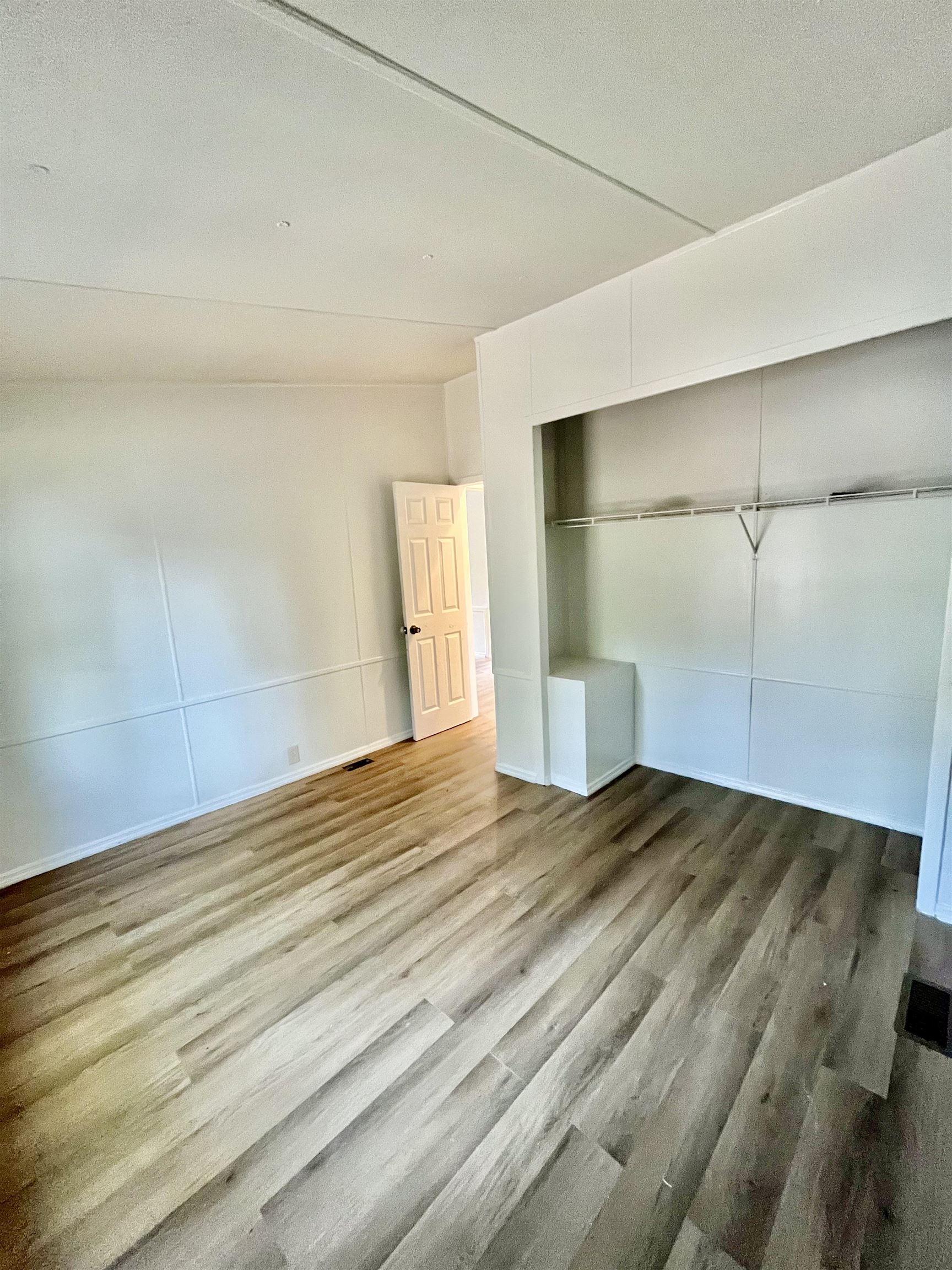 23670 Northeast 154th Place Road Salt Springs, FL 32134 - Photo 20 of 65 a view of empty room with wooden floor