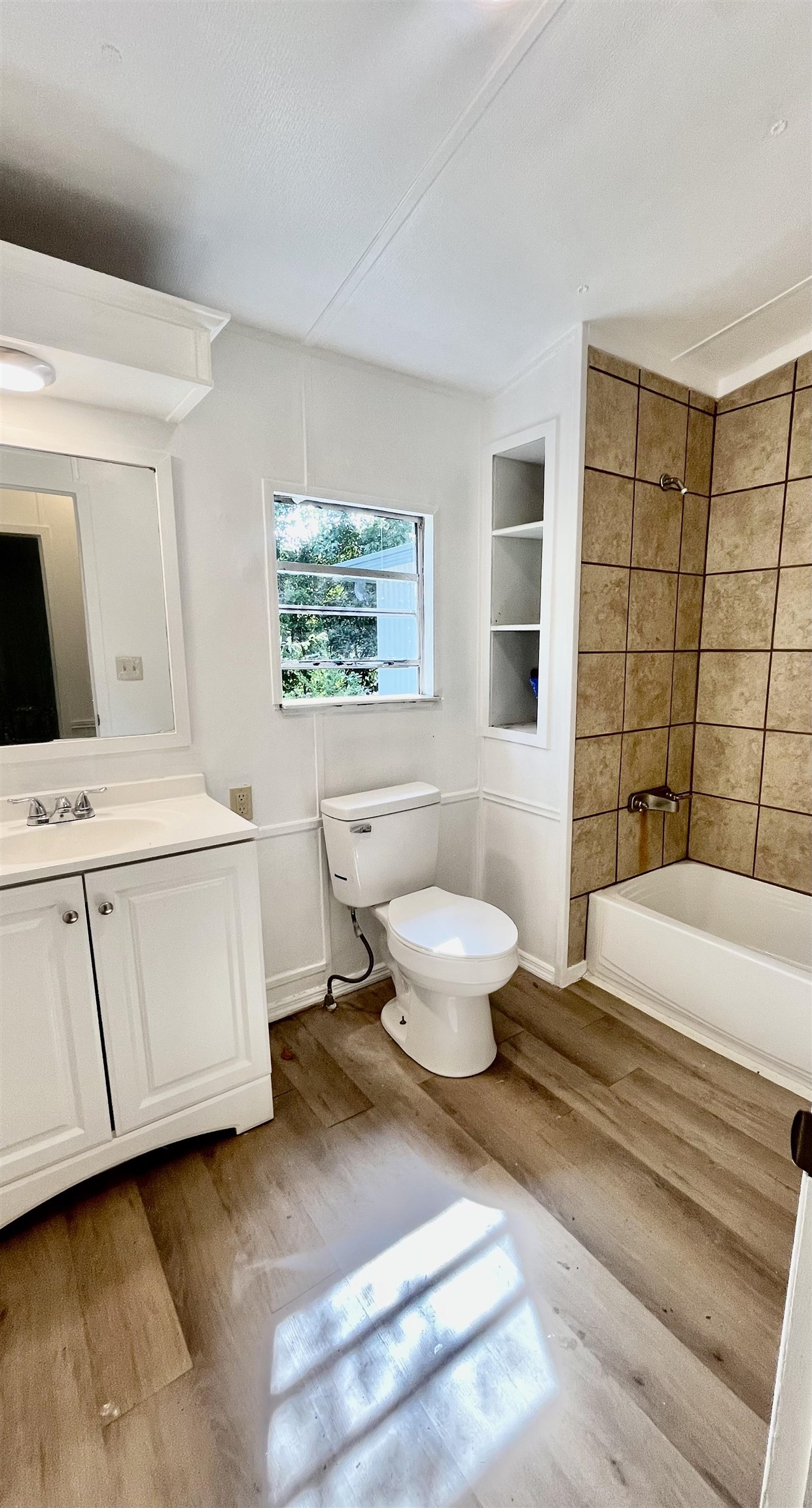 23670 Northeast 154th Place Road Salt Springs, FL 32134 - Photo 27 of 65 a bedroom with a bed and a window